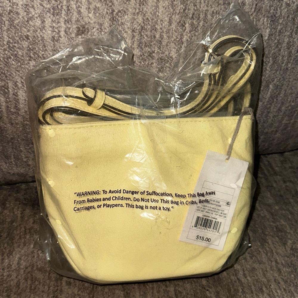 NWT cute pastel yellow mini purse.
